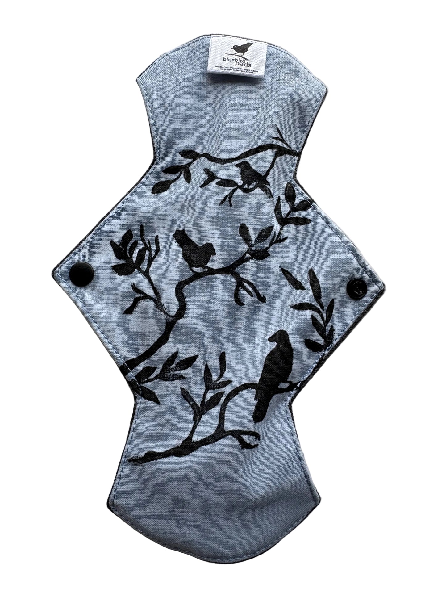 Reusable medium absorbent menstrual pad with bird stamp of a periwinkle background