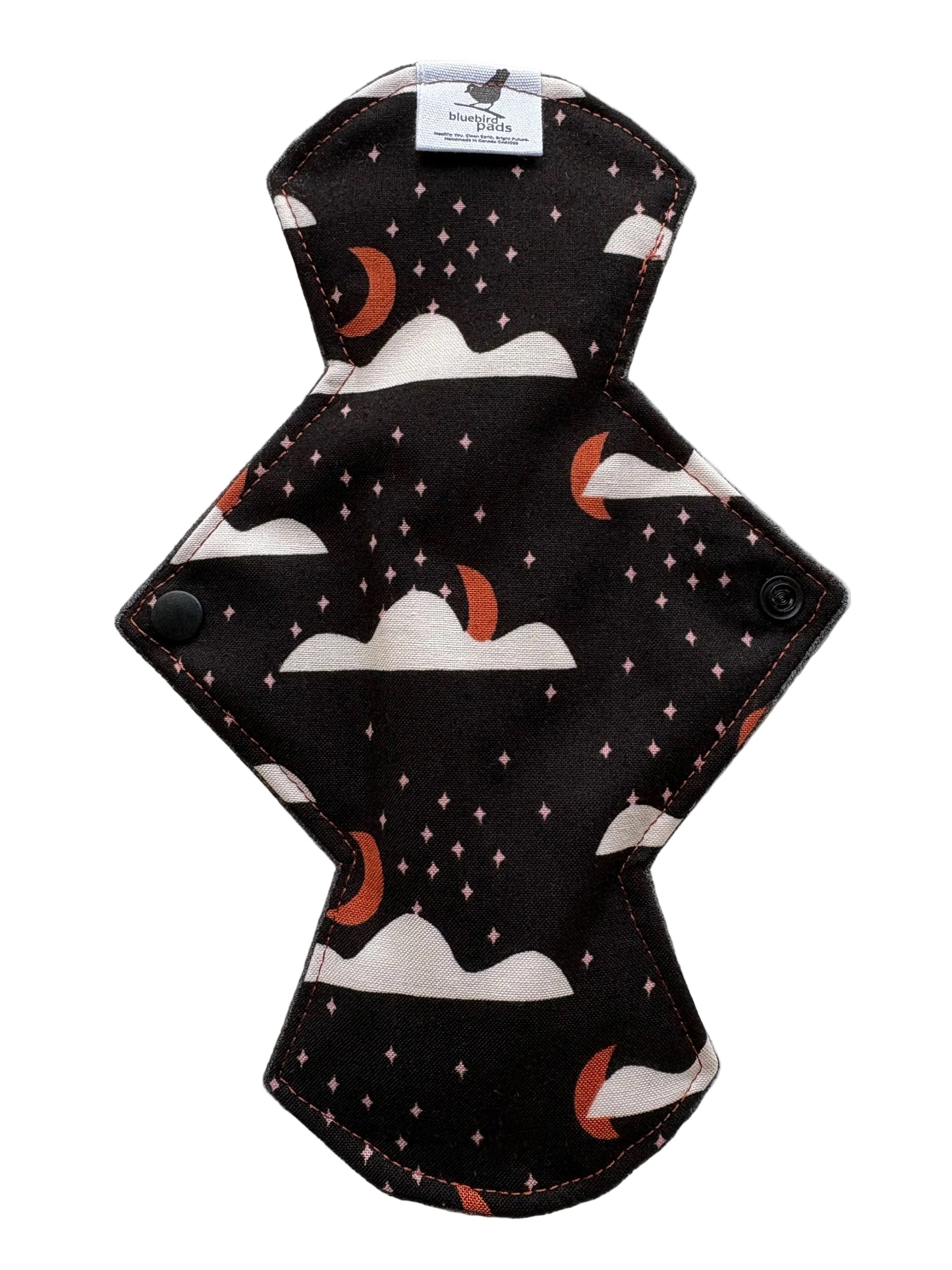 Reusable menstrual pad with Harvest moon and black background