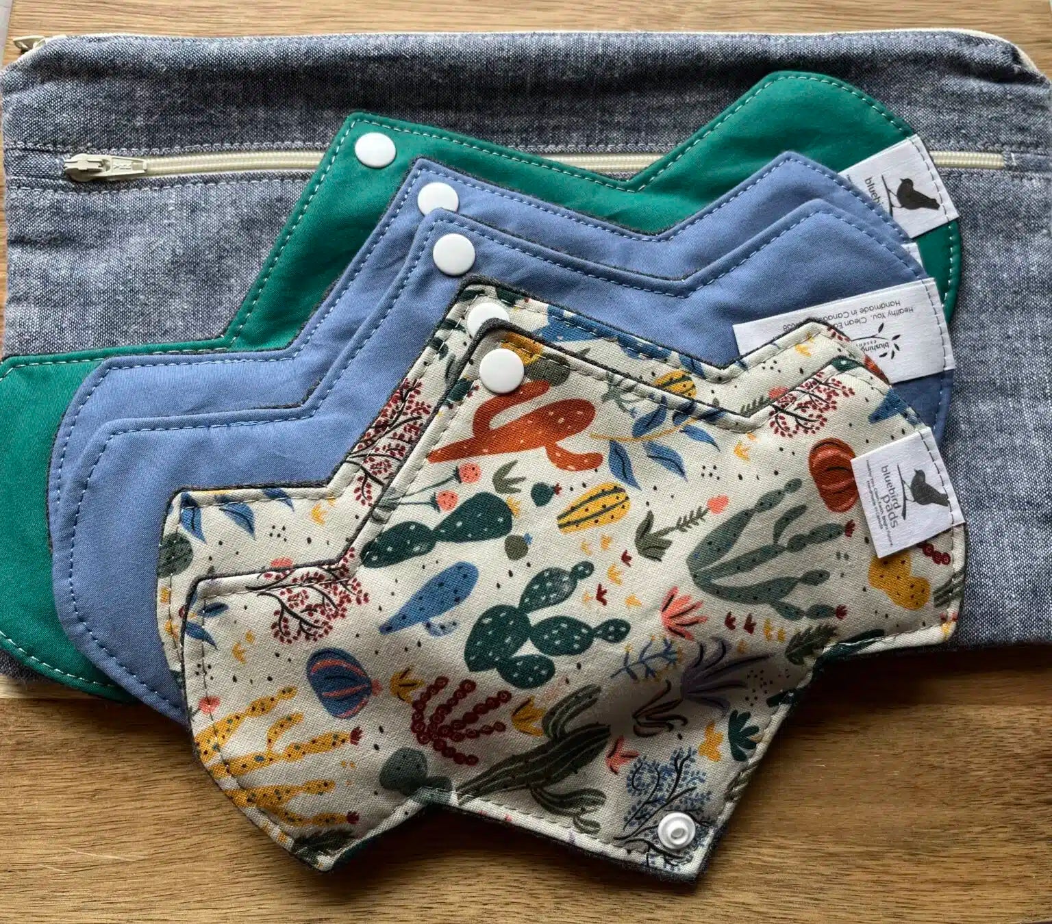 An assortment of feminine pads and Protectors with different designs and colors 
