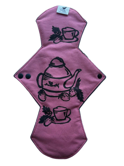 Pink cloth pad with black tea-themed stamped design  for period or incontinence 
