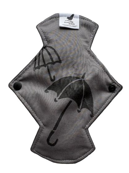 Gray pad with black umbrella stamp on it
